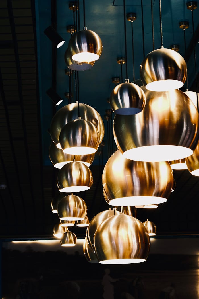 Close-up of illuminated hanging pendant lamps creating a modern aesthetic.